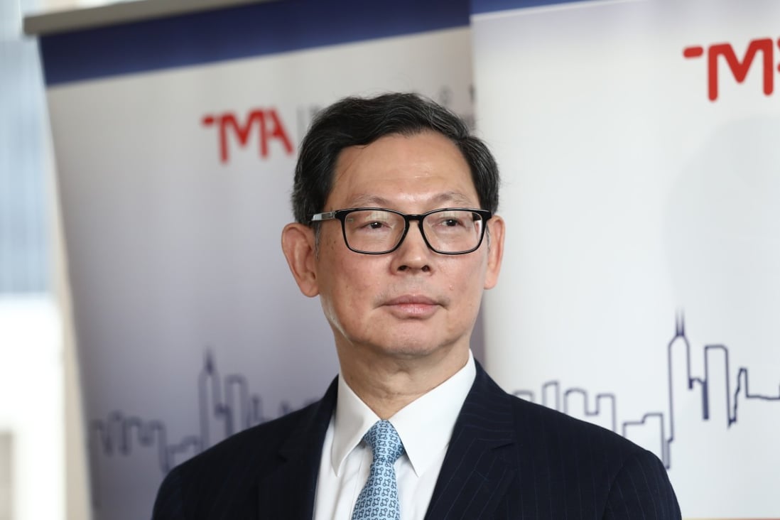 Norman Chan Tak-lam, chief executive of the Hong Kong Monetary Authority, speaks at the Treasury Markets Summit. Photo: Jonathan Wong