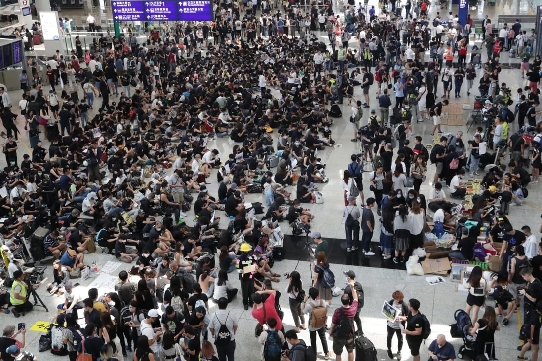 Protesters stage a sit-in at Hong Kong International Airport on August 9. Photo: Edmond So