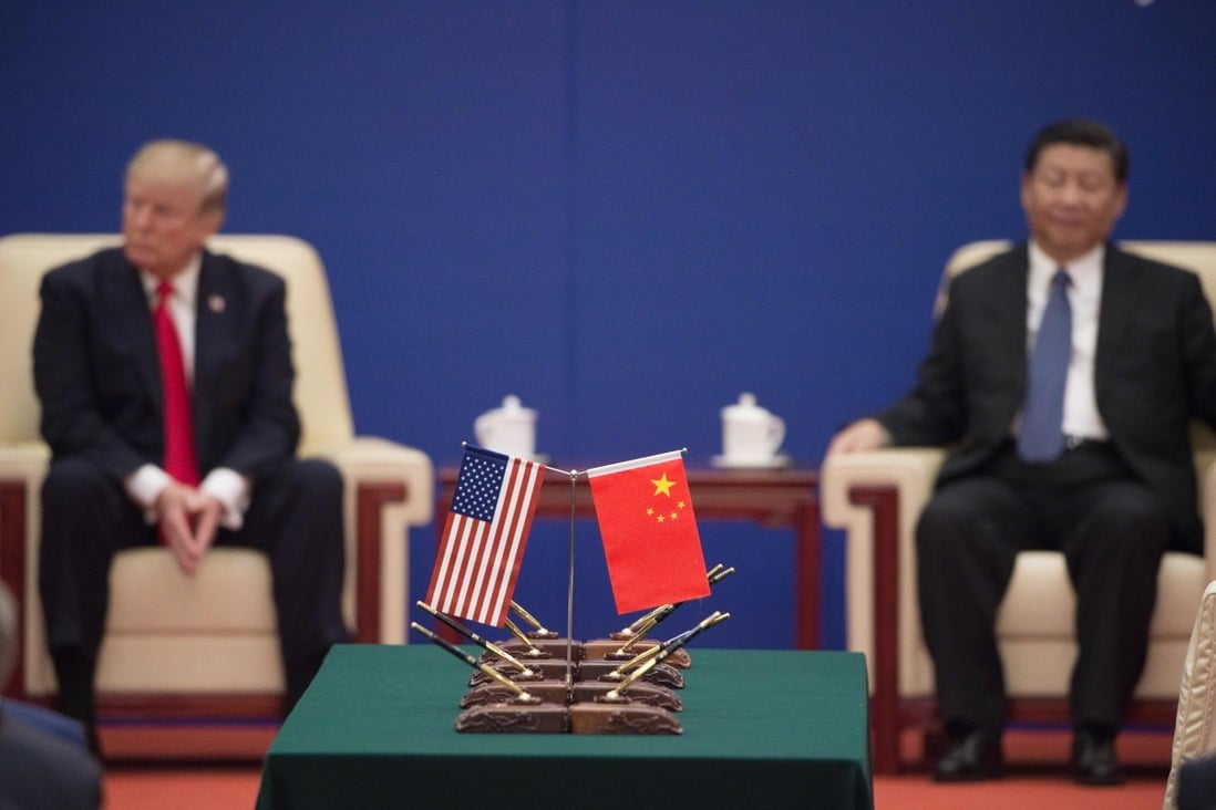 US President Donald Trump (L) and China's President Xi Jinping attend a business leaders event inside the Great Hall of the People in Beijing. Photo: AFP