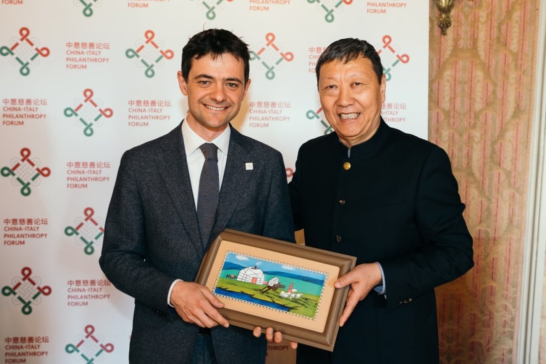 Giovanni Andornino (left) pictured with Niu Gengsheng, says that as Chinese businesses have become globalised so should their charitable projects. Photo: Handout