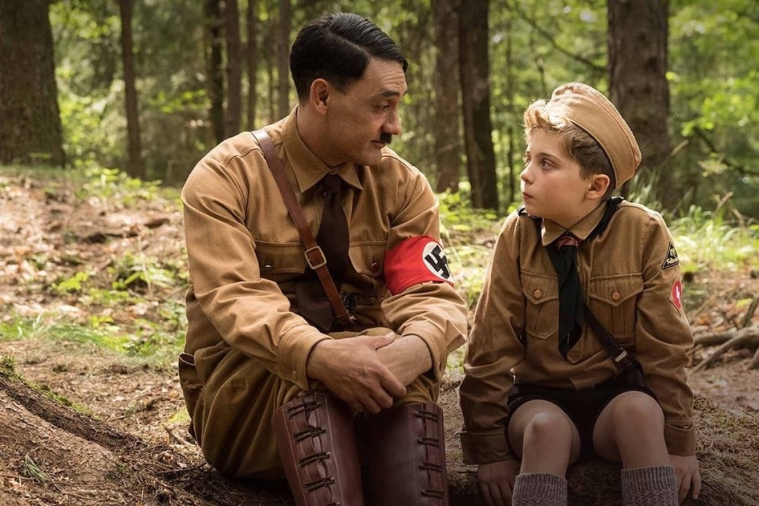 Taika Waititi and Roman Griffin Davis in a scene from Jojo Rabbit (category: TBC), directed by Waititi. The film also stars Sam Rockwell and Scarlett Johansson.