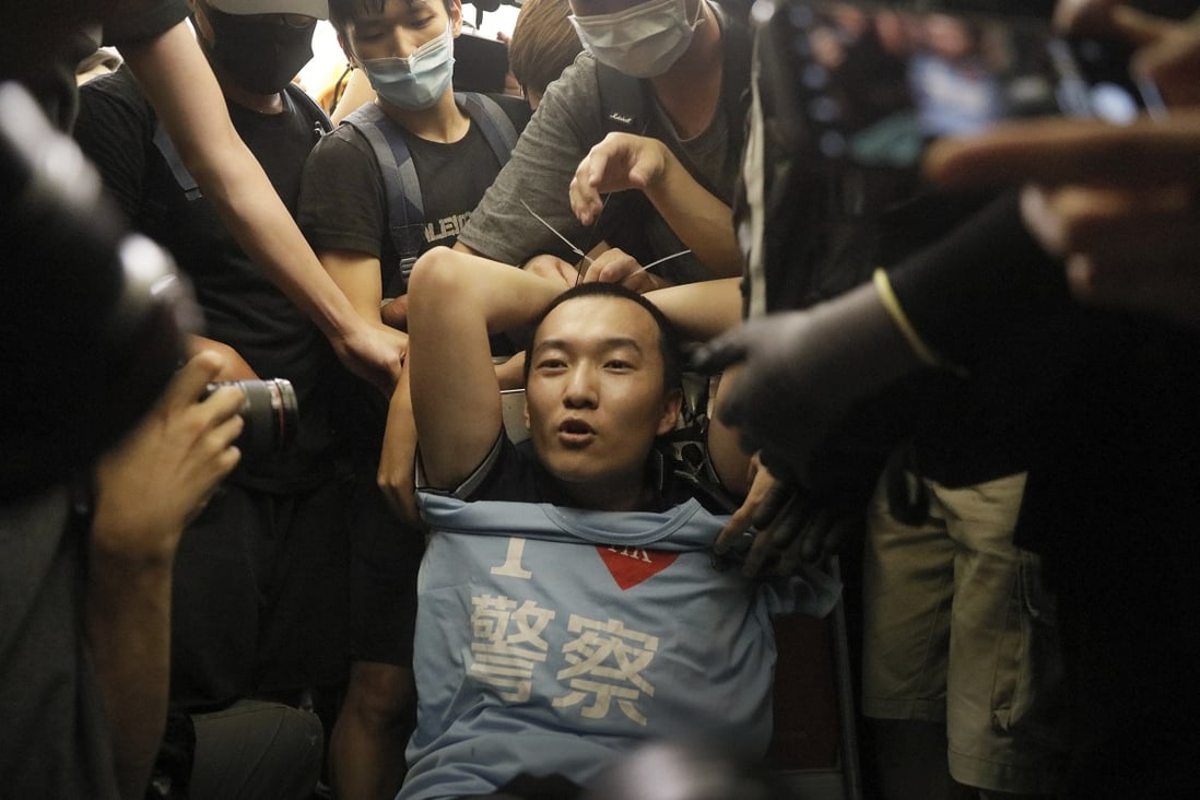 Global Times journalist Fu Guohao has been honoured by his employer after he was seized and assaulted by anti-government protesters last month at Hong Kong airport. Photo: AP