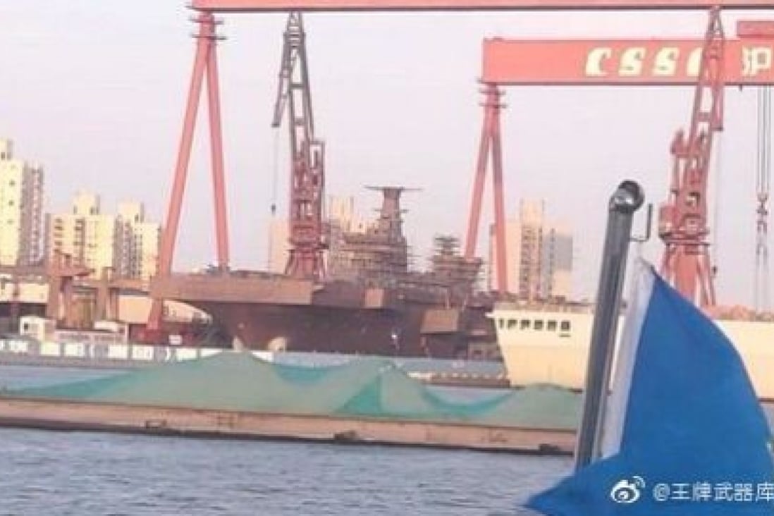 Military enthusiasts published this image of China’s first Type 075 amphibious helicopter assault ship during the summer, and sources say the vessel will be launched on Thursday. Photo: Weibo
