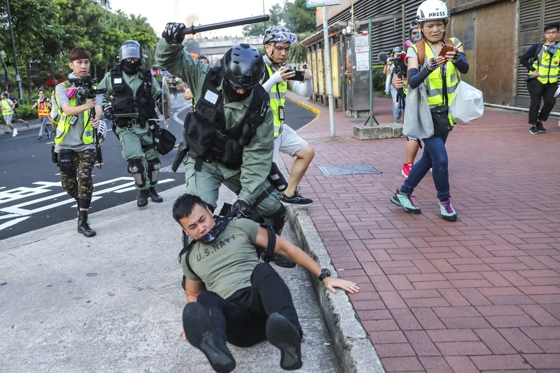Riot police arrest an anti-government protester on September 22. Photo: Sam Tsang