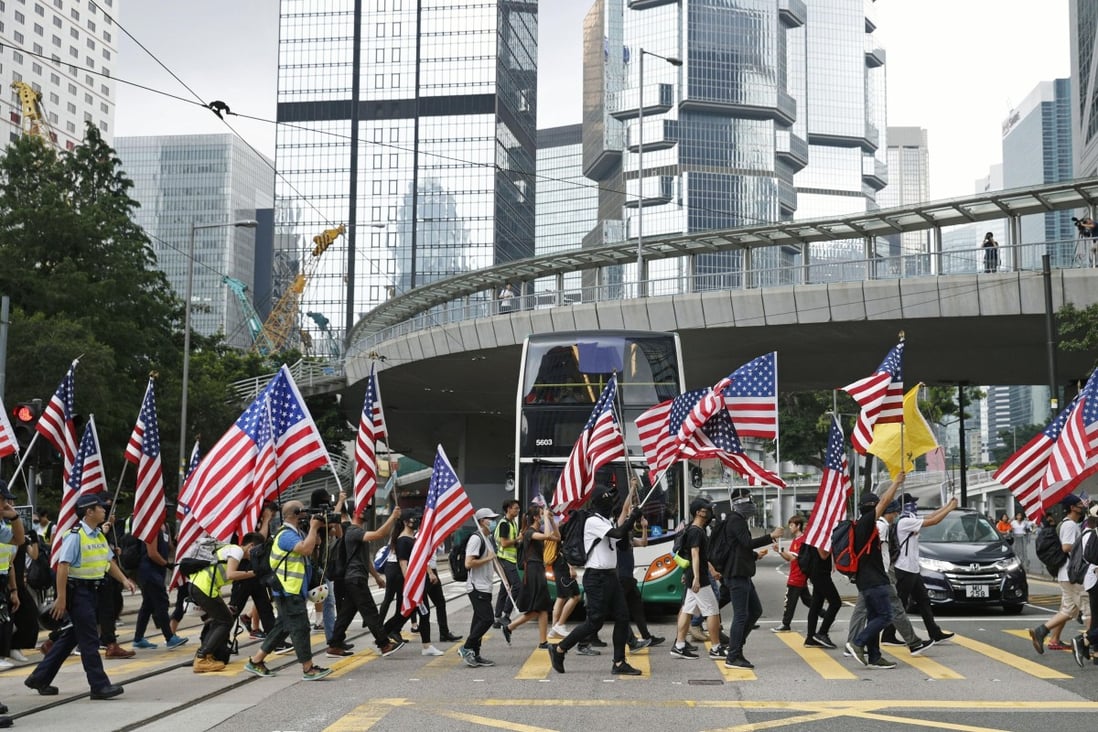 Demonstrators head to the US Consulate in Hong Kong on September 8, calling on American lawmakers to support democratic aspirations in the city. On Tuesday, a bill aimed at doing that passed the House and Senate. Photo: Kyodo