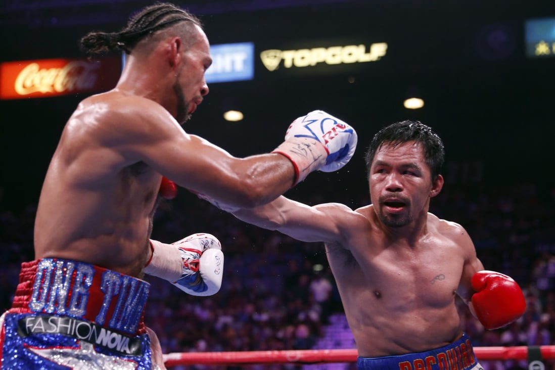 Manny Pacquiao punches Keith Thurman during their WBA welterweight title fight in July 2019. Photo: AFP