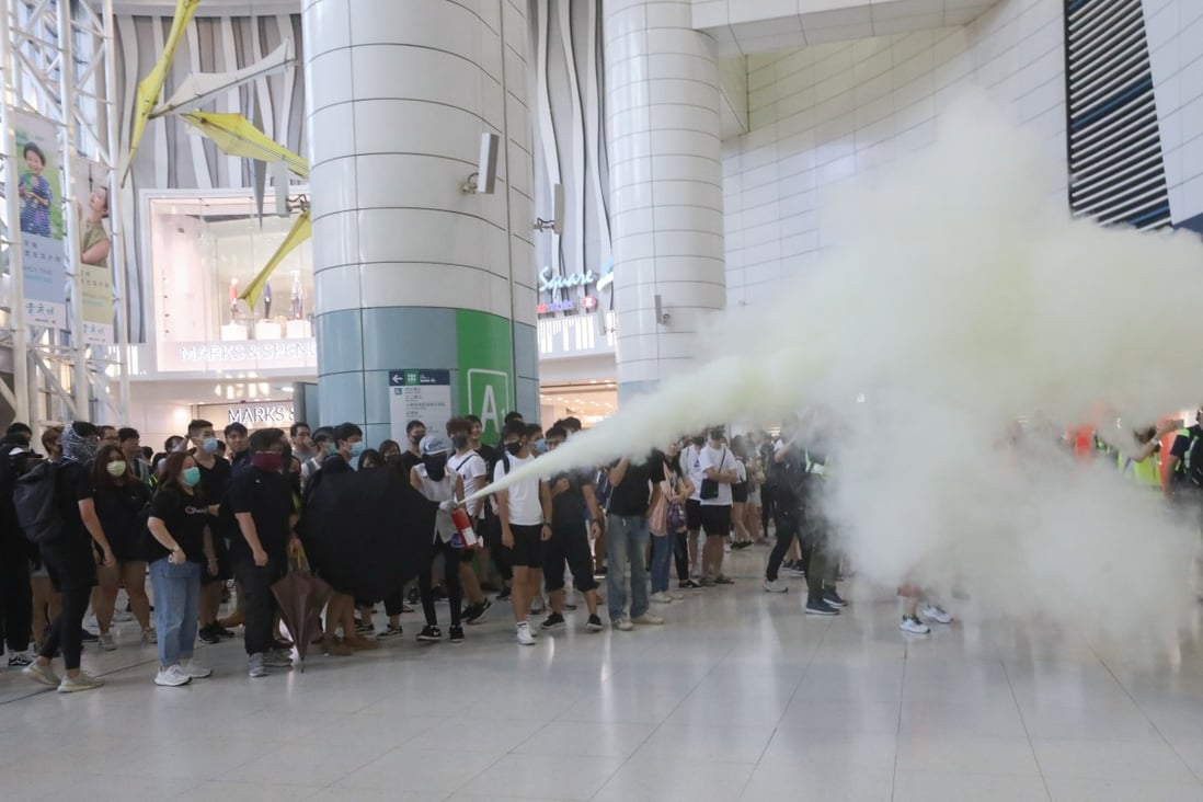 Anti-government protesters use fire extinguisher in Tsing Yi Station on 22 September 2019. Photo: Dickson Lee