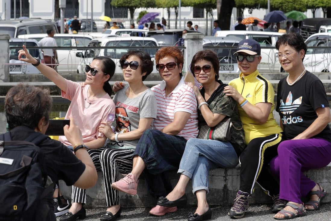 Chinese tourists at the Maha Bandula park in Yangon. Asian economies are becoming increasingly interconnected, in terms of trade and travel. Photo: EPA-EFE