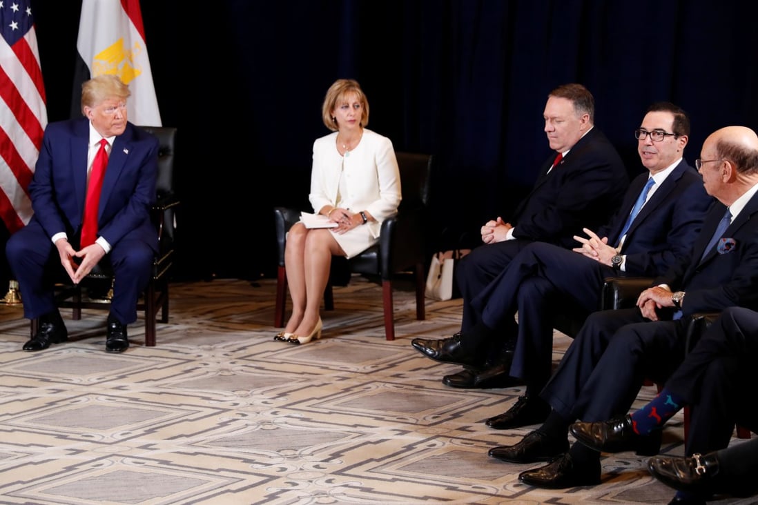 U.S. President Donald Trump looks on as Treasury Secretary Steve Mnuchin explains a delay in a Chinese agricultural trade delegation visiting the U.S. Photo: Reuters