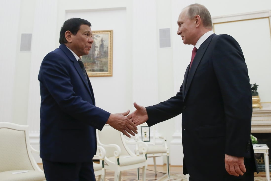 Philippine President Rodrigo Duterte (left) shakes hands with Russian President Vladimir Putin during their meeting at the Kremlin in Moscow in May 2017. Photo: AP