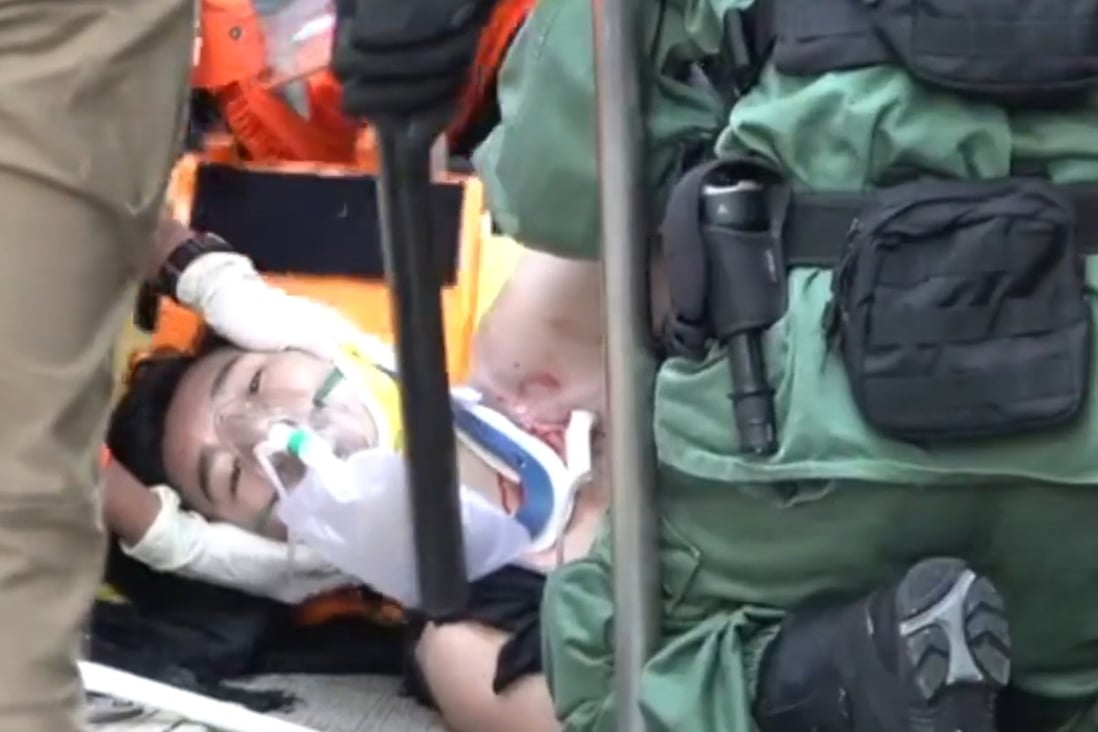 A screen capture from Stand News footage shows the teen being treated for his wound.