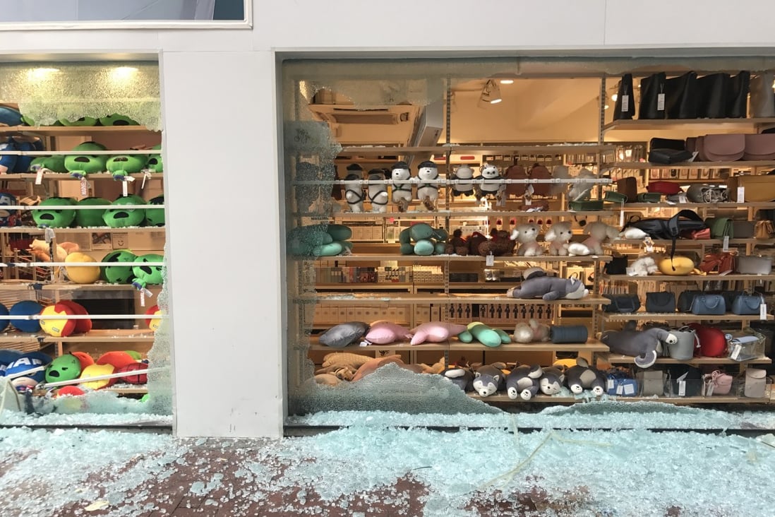 Shards of glass cover the pavement after radical elements of the protest movement target the Miniso branch in Tsuen Wan. Photo: Yujing Liu