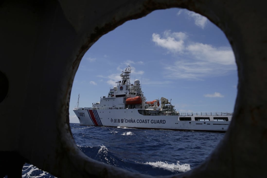 A Chinese coastguard ship attempts to block a Philippine government vessel at Second Thomas Shoal in 2014. Photo: AP