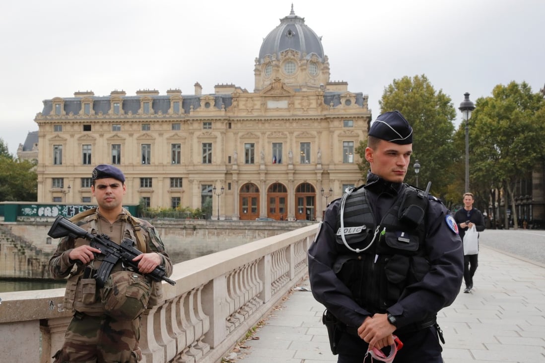 Police secure the area in front of the Paris police headquarters. Photo: Reuters