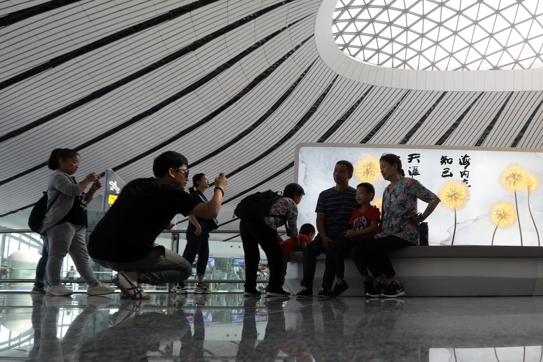 Beijing’s Daxing International Airport is a hit with travellers, but it also attracts social media snappers who get in the way of everyday business, security staff say. Photo: Simon Song