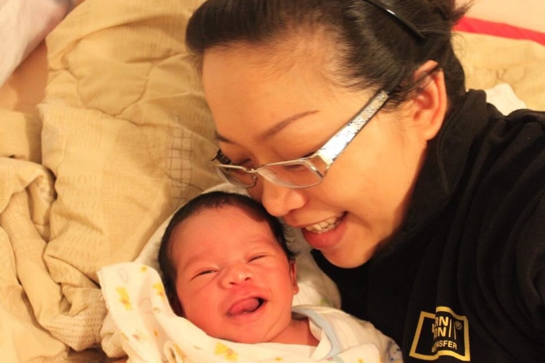 Mother-of-two Serena Eze and her son Spencer from Whampoa in Hong Kong. Eze turned her breast milk into a body lotion and face mask to use while away on business trips. Photo: Serena Eze