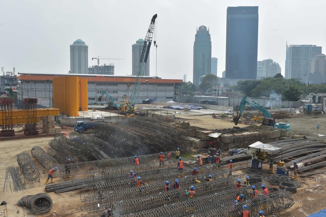 Indonesian labourers work at a construction site in Jakarta. The country has missed a wave of manufacturers seeking to bypass higher tariffs from the US-China trade war, according to two private sector economists. Photo: AFP