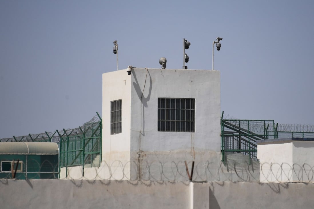 Surveillance cameras on the outer wall of a possible detention camp in Xinjiang. Photo: AF