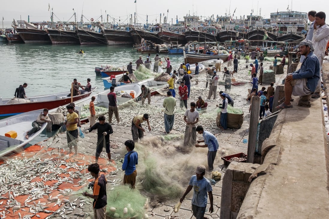 Fishermen at the harbour in Gwadar, Balochistan, Pakistan. What used to be a small fishing town has been transformed by Chinese investment. Photo: Bloomberg