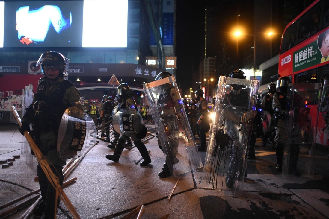 Hong Kong police clears an area in Mong Kok, following a stand-off with protesters who gathered outside the district’s police station on October 7. Photo: Agence France-Presse