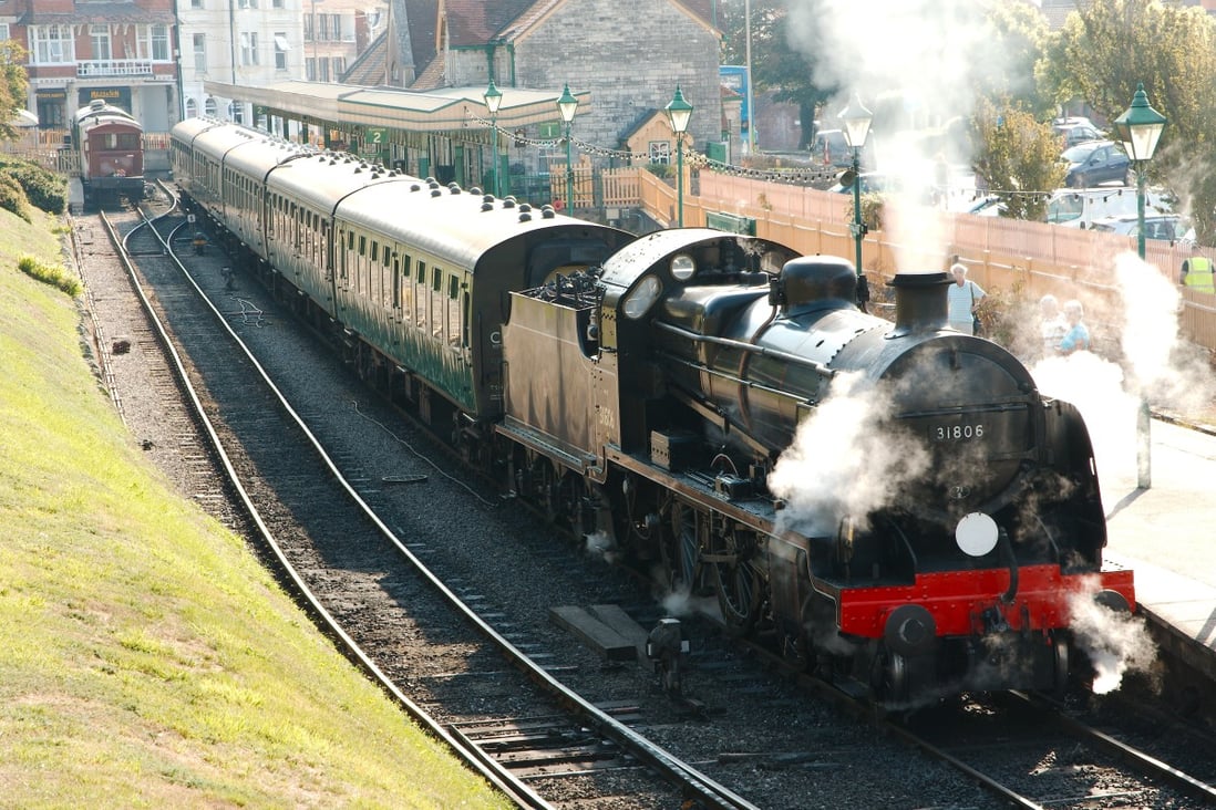 A classic train pulls out of Swanage station
