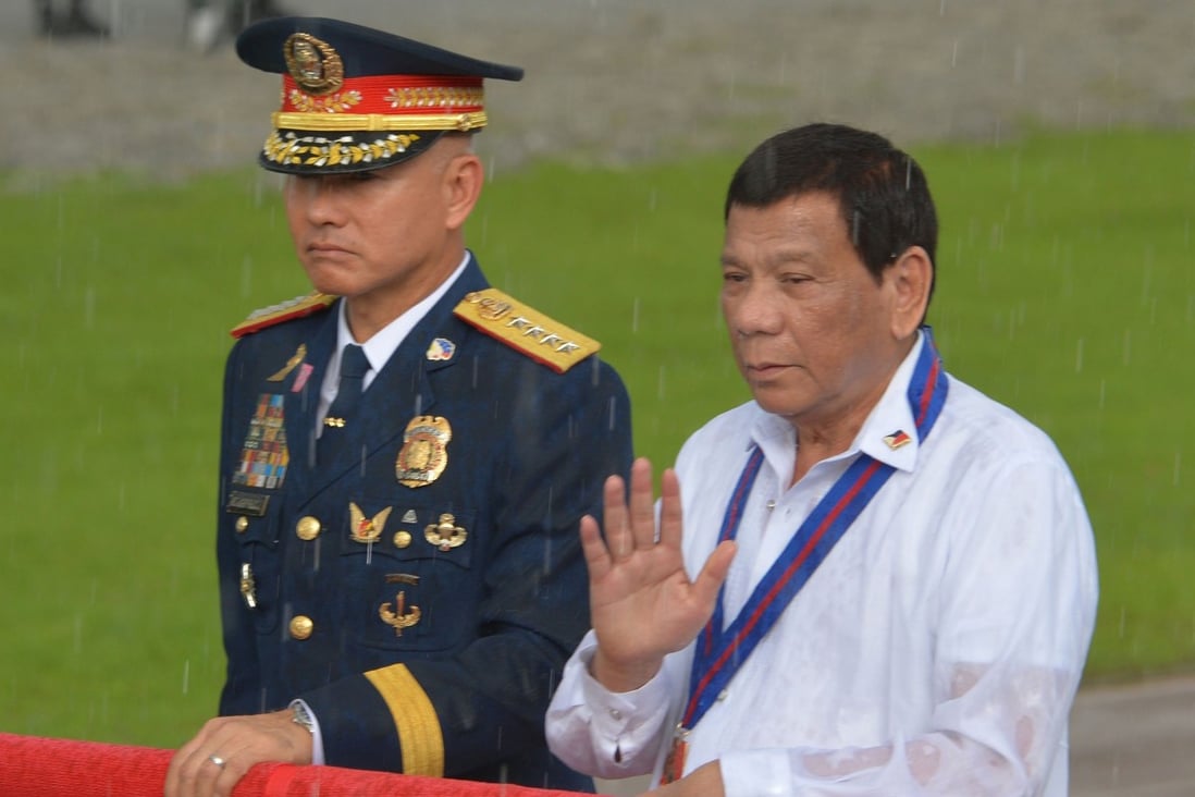 Former Philippine national police chief Oscar Albayalde and Philippine President Rodrigo Duterte during a police event in Manila. Photo: AFP