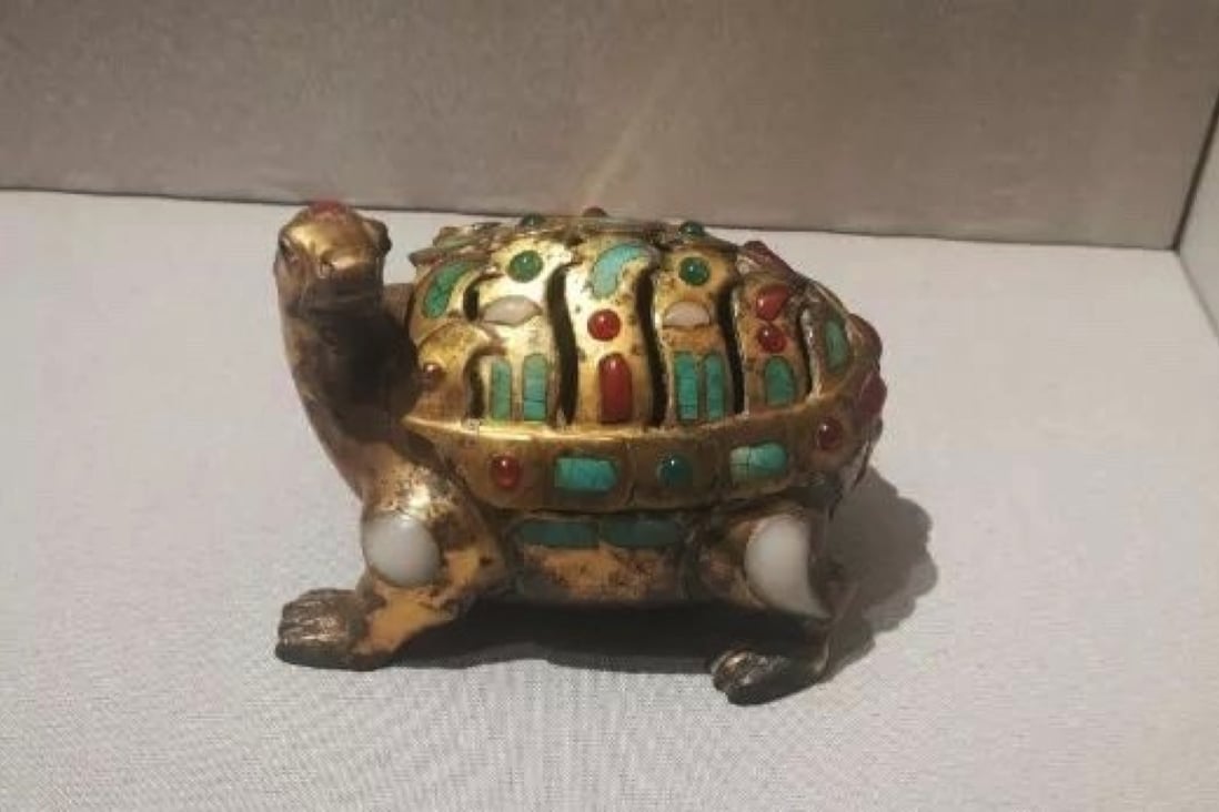 A tortoise ornament at the Museum of Chongqing University was said to be over 2,000 years old but appears to have been electroplated in gold. Photo: Handout