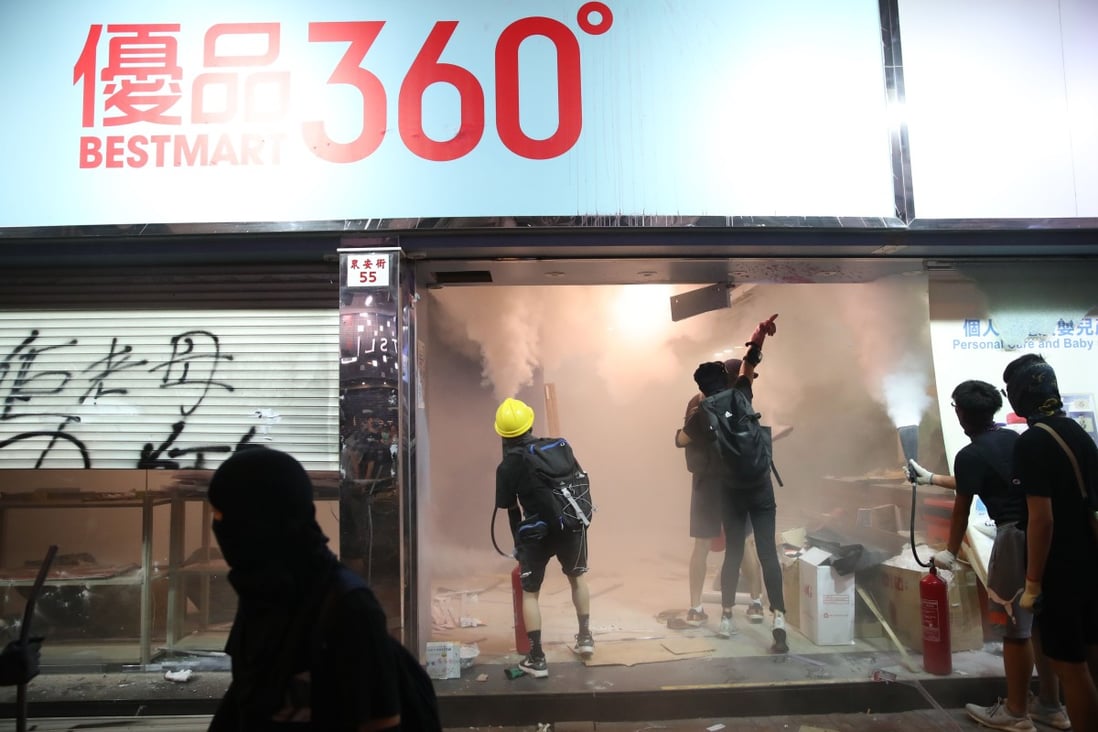 Protesters vandalise a BestMart 360 store in Tsuen Wan. Photo: Winson Wong