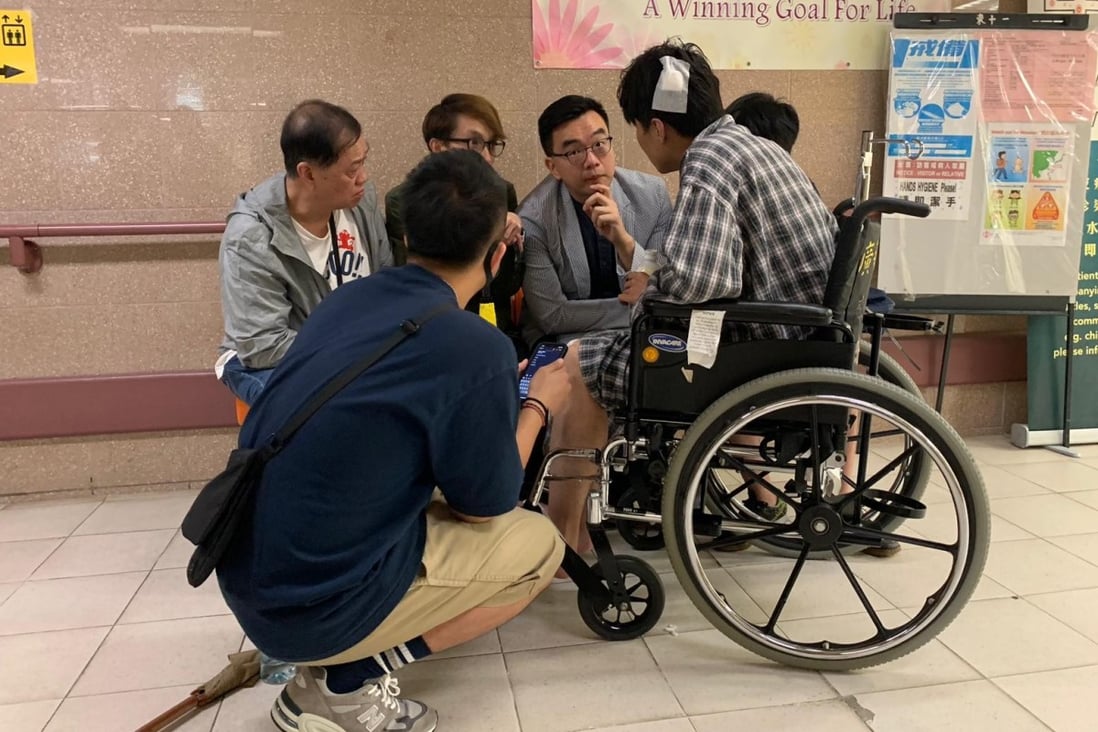 Sham was seen in a wheelchair talking to his lawyer on Thursday morning. Photo: Martin Choi