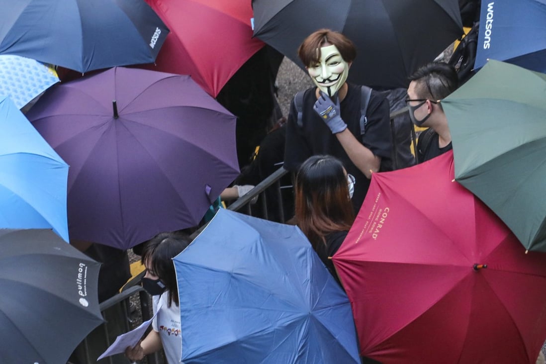 Protesters in Central defy the mask ban. Photo: Felix Wong