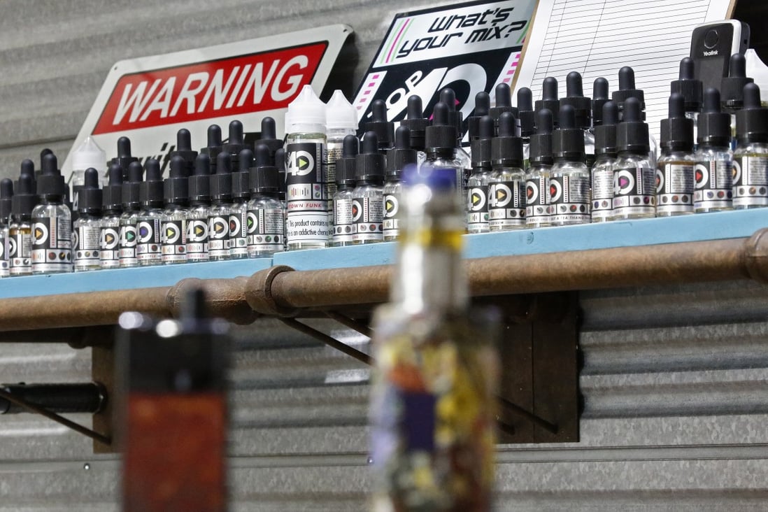 Vaping machines are displayed on a counter with other items on shelves inside a shop in Texas on September 6. The US Centres for Disease Control and Prevention issued a warning on the use of e-cigarettes. Photo: EPA-EFE