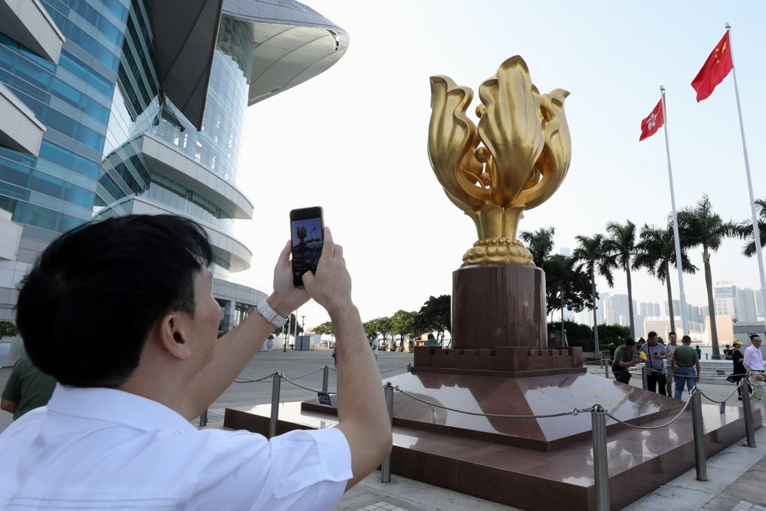Mainland tourists at the Golden Bauhinia Square in Wan Chai. Photo: Dickson Lee