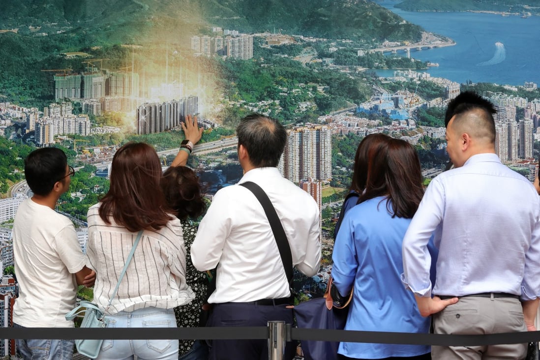 Potential buyers queue up for their turn to buy flats in China Evergrande’s Emerald Bay residential project in Tuen Mun. Photo: May Tse