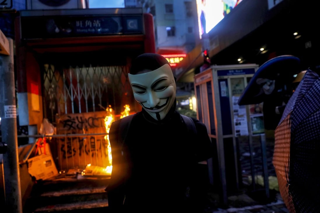 A masked anti-government protester on October 6, 2019. Photo: Reuters