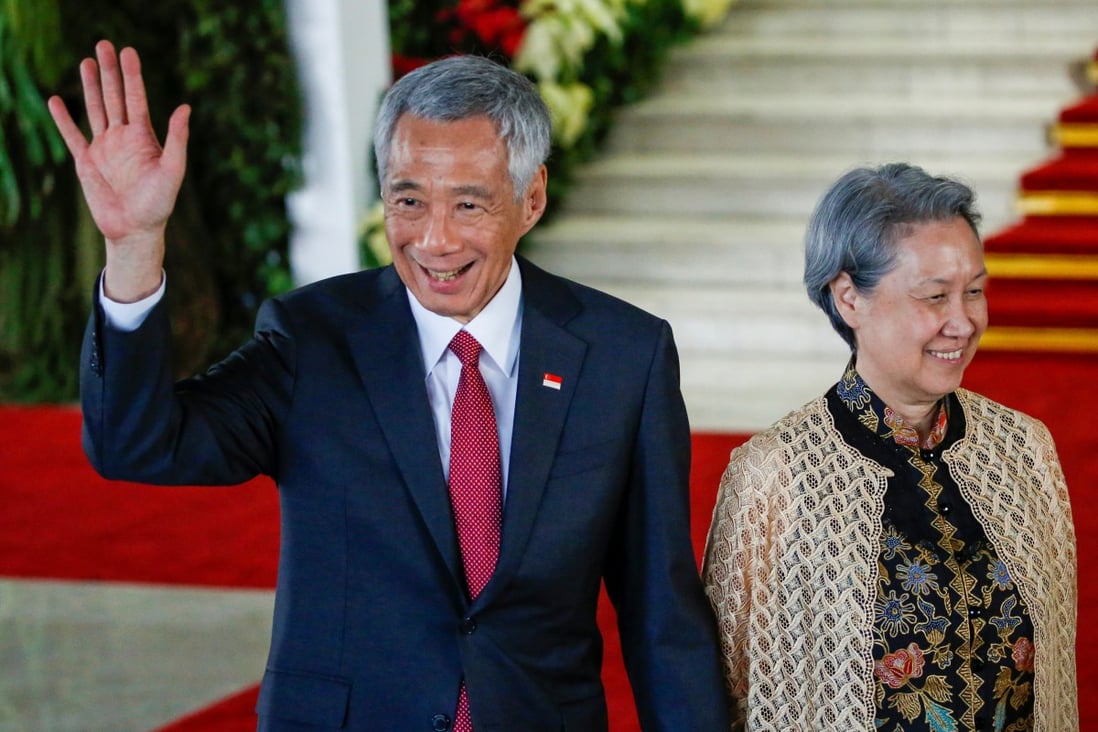 Singapore's Prime Minister Lee Hsien Loong with his wife Ho Ching in Indonesia. Ho has issued a rarely seen response to a Bloomberg article. Photo: Reuters