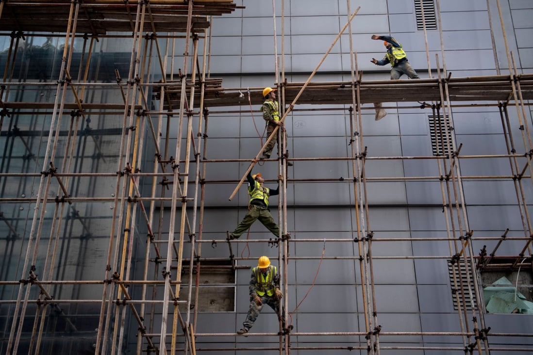 Workers erect scaffolding at a construction site in Beijing in 2019. China came fourth in a new report’s measure comparing 114 economies across traditional growth drivers such as infrastructure building. Photo: AFP