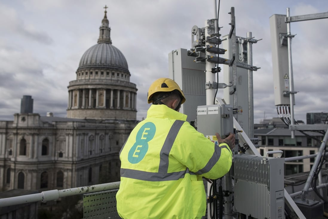 An engineer checks 5G equipment undergoing trials in London, overlooking St Paul’s Cathedral, in March. Photo: Bloomberg