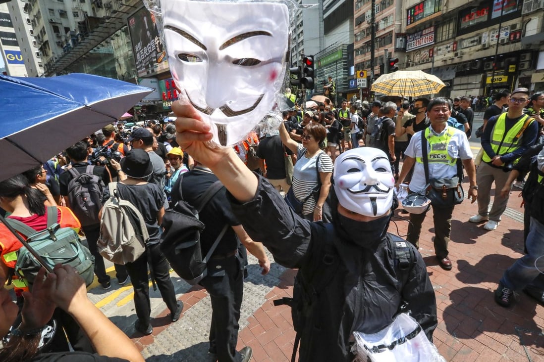 Masked protesters during an anti-government rally in Causeway Bay on October 1. Photo: Felix Wong