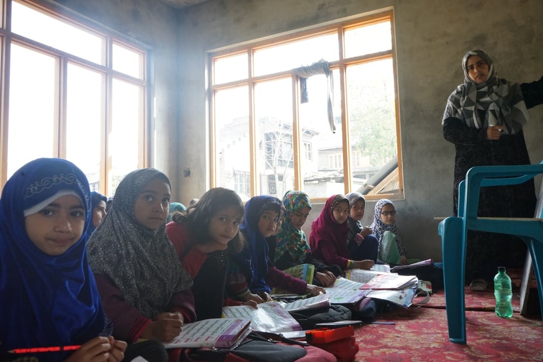 Year 1 students attending an English class at the school set up in Ghulam Mohammad Ganai’s house in Samboora. Photo: Adnan Bhat