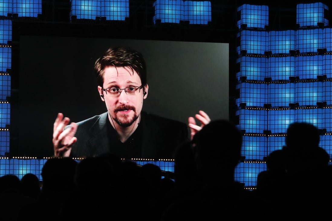 Former US National Security Agency contractor Edward Snowden addresses attendees through video link at a technology conference in Lisbon on November 4. Photo: AP
