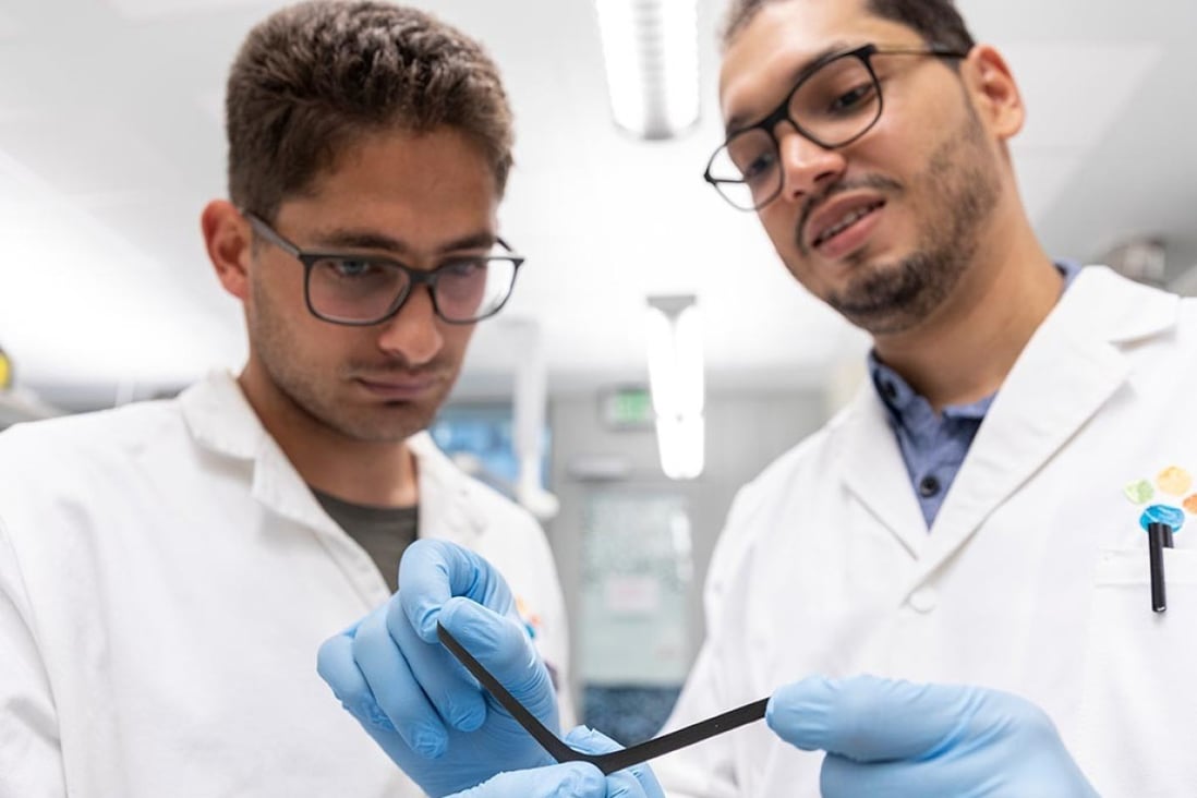 PhD students Liam Swanepole (left) and Abdullah Almansouri with the electronic skin. Photo: KAUST