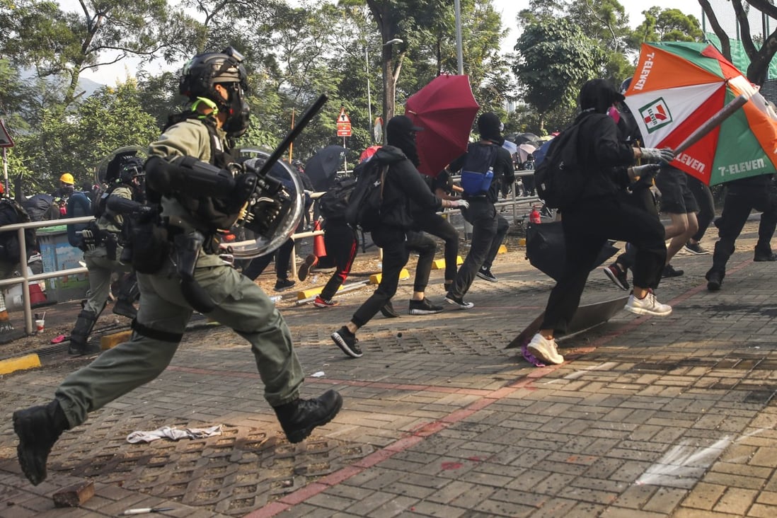 Clashes erupt between anti-government protesters and riot police as they fire tear gas into the campus and make arrests at the Chinese University of Hong Kong on Tuesday. Photo: Winson Wong
