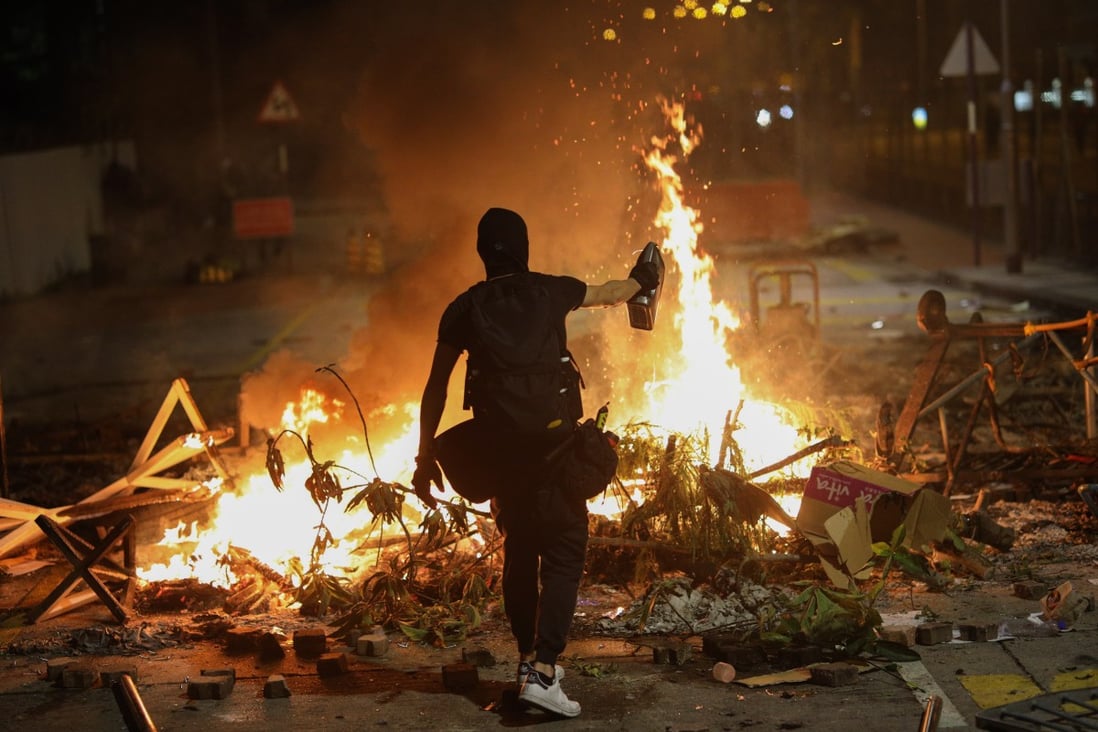A protester burns a rubbish pile at the Chinese University of Hong Kong. Photo: EPA