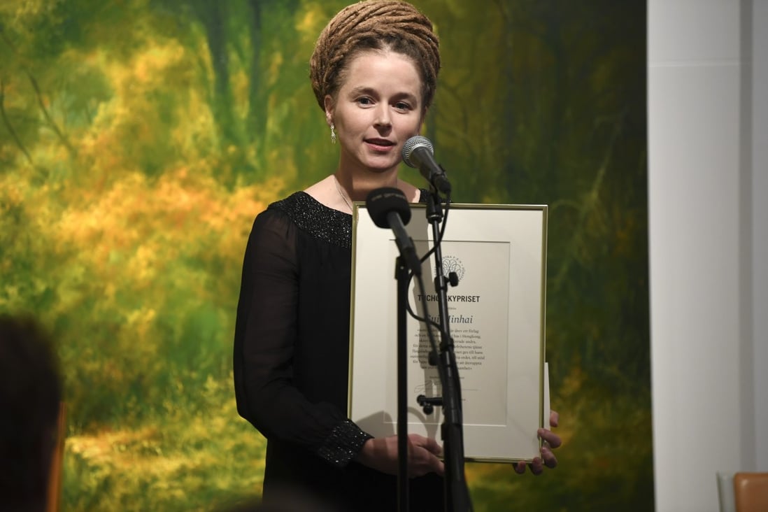 Sweden’s Culture Minister Amanda Lind presents the Svenska PEN Tucholsky Prize to detained Swedish bookseller Gui Minhai on Friday. Photo: AP