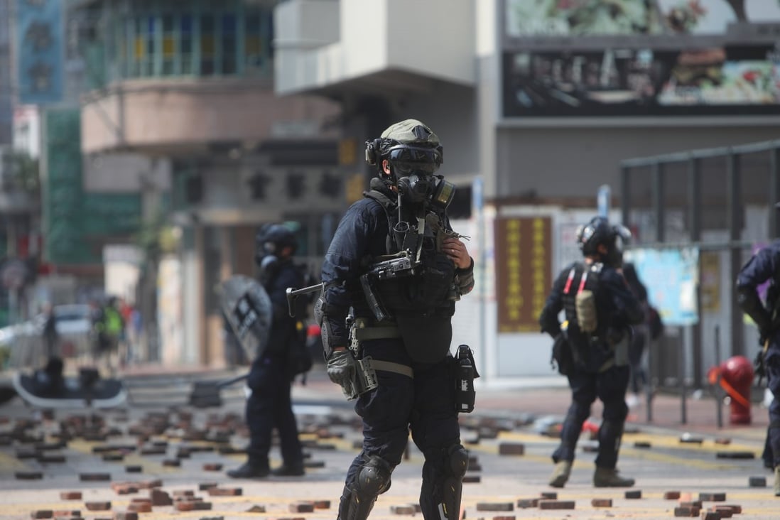 A police officer with a submachine gun during a clash with protesters on Nathan Road in Tsim Sha Tsui. Photo: Winson Wong