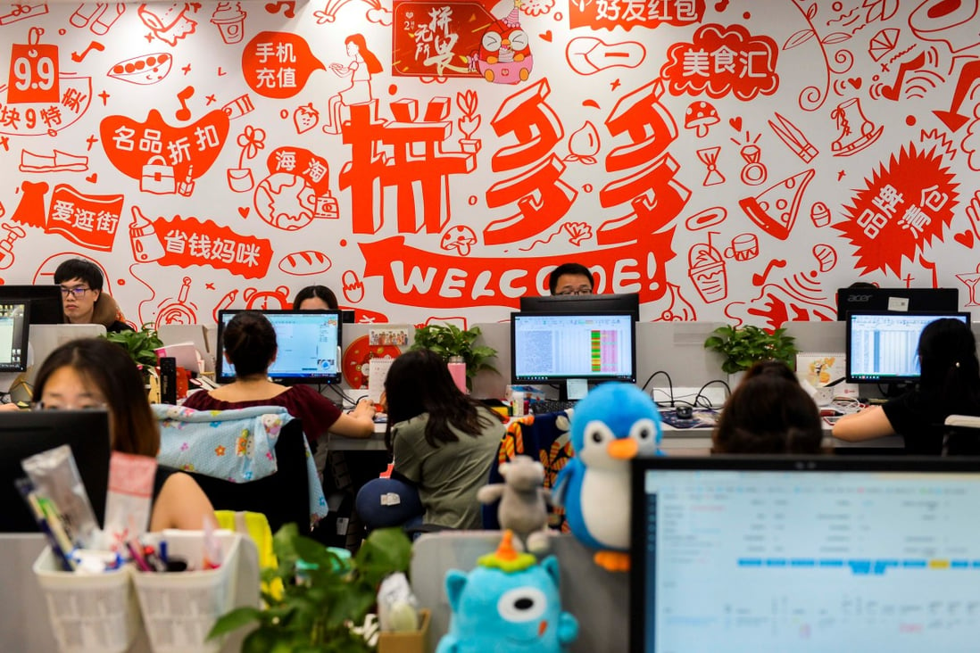 Staff of e-commerce services provider Pinduoduo are seen at their desks at the company’s headquarters in Shanghai. Photo: Reuters