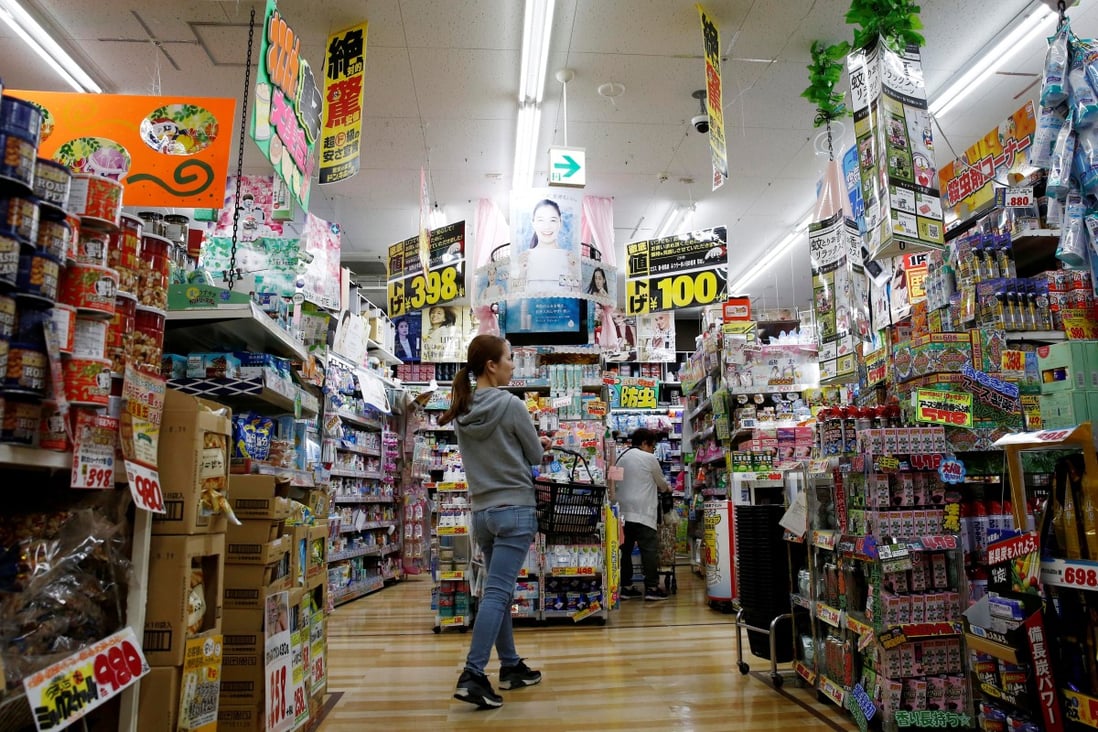 Shoppers browse at a discount store in Tokyo. Hit by the trade war, the Japanese economy expanded by just 0.2 per cent in the third quarter of 2019. Photo: Reuters