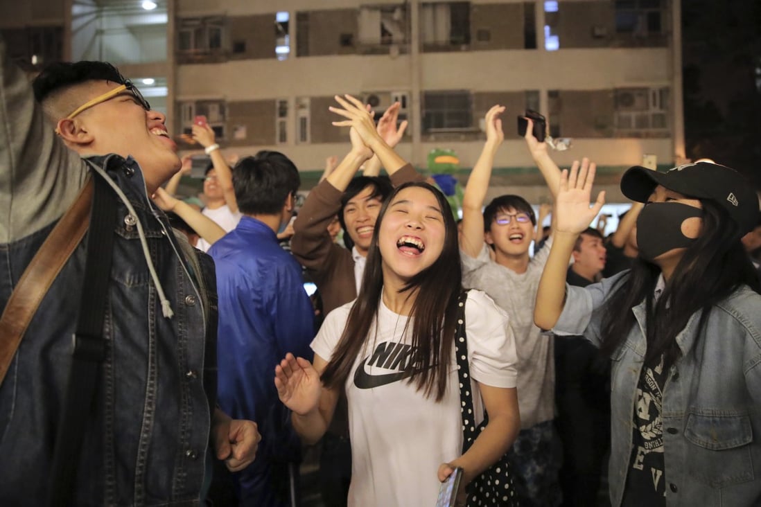 Pro-democracy supporters celebrate huge gains in the district council elections. Photo: AP
