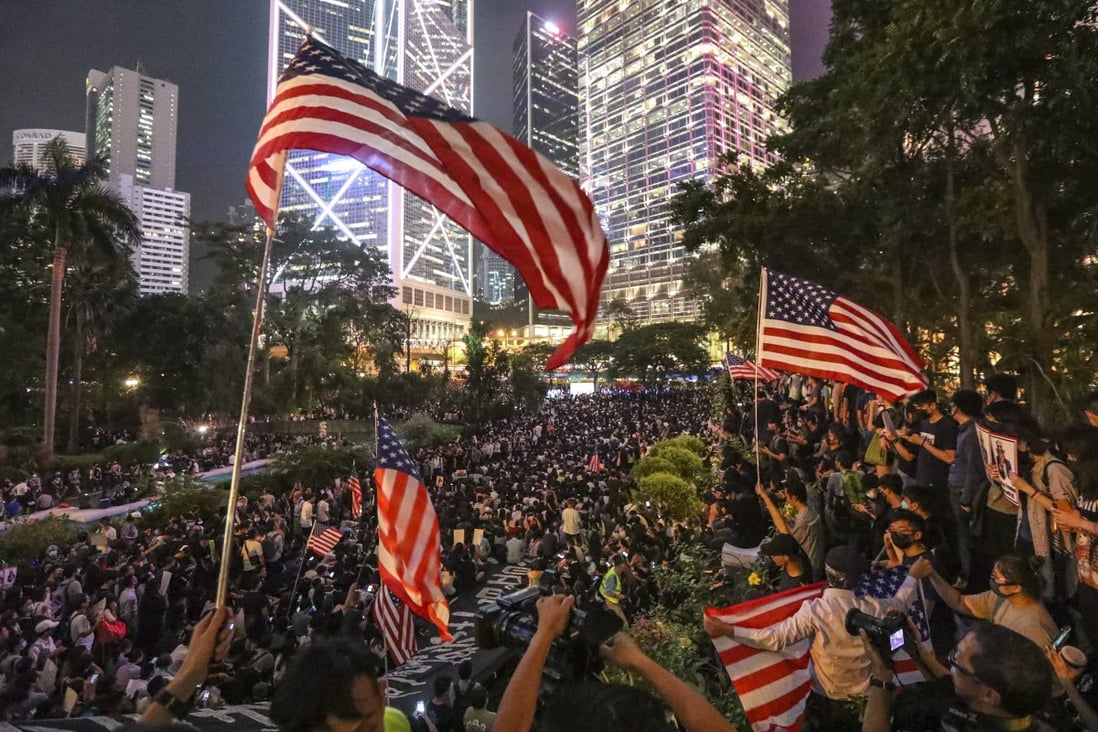 Anti-government protesters wave US flags during a demonstration in Central in October to urge the US Congress to pass the Hong Kong Human Rights and Democracy Act. Photo: Felix Wong
