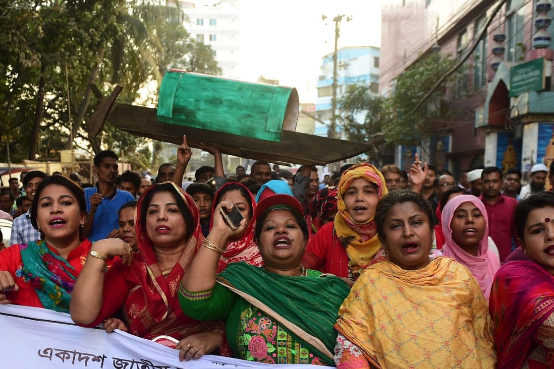 Supporters of Bangladesh’s Awami League march in the street as part of a general election campaign procession in Dhaka in December 2018. Photo: AFP